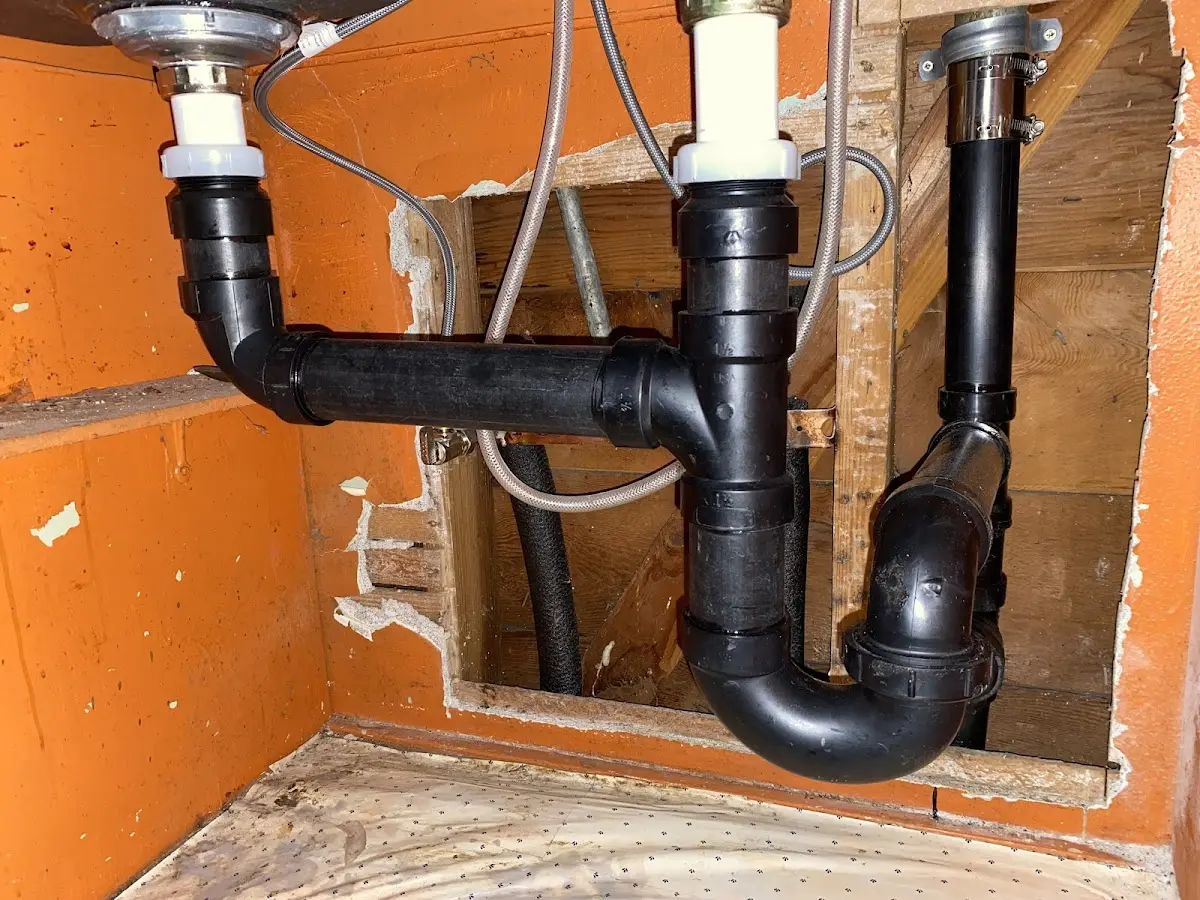Professional Garbage Disposal Repair equipment and tools on the job in Waterloo